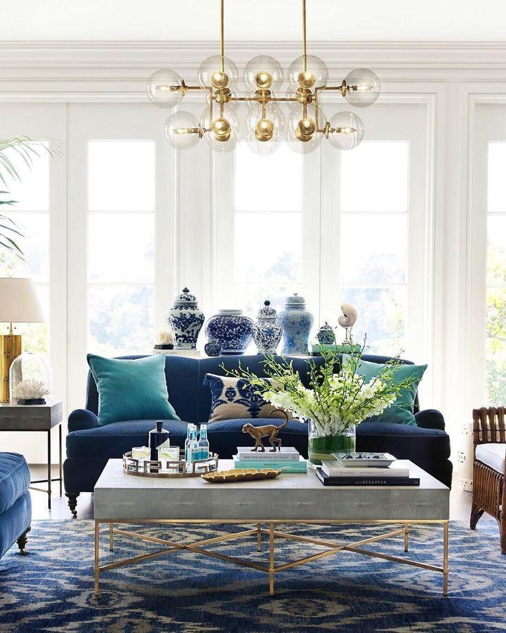 Hang a statement chandelier to elevate ‌your​ blue living ⁤room ambiance