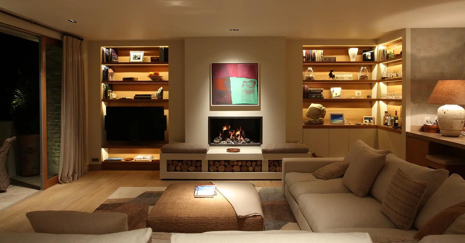 Layered lighting, combining ambient and task options, enhances functionality in the living room