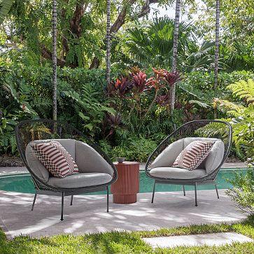 Add comfortable seating for lounging in your backyard escape