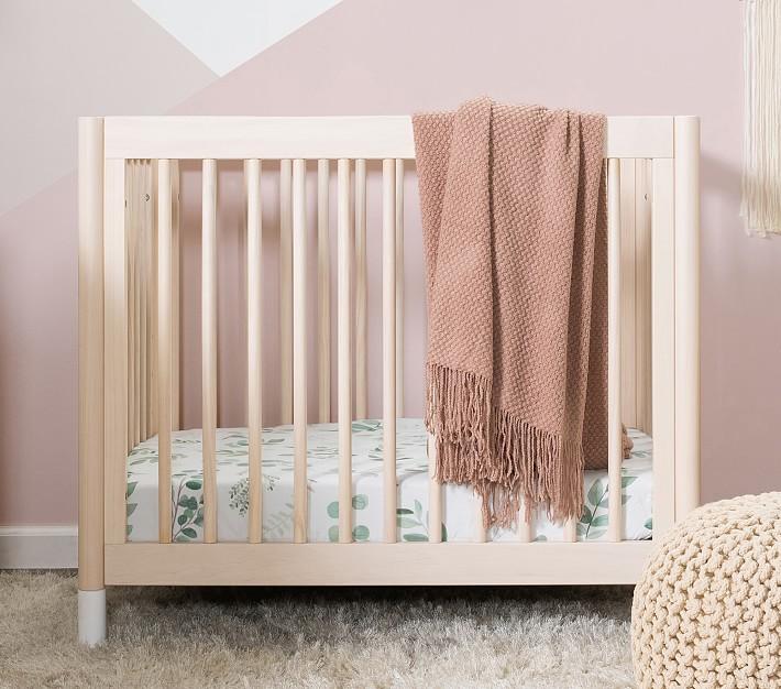 Choose a crib that converts as your child grows in your small nursery