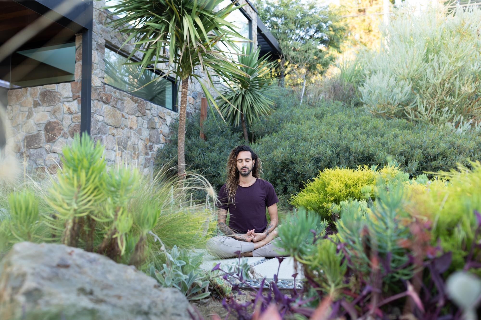 Designate a meditation space for tranquility in your backyard oasis