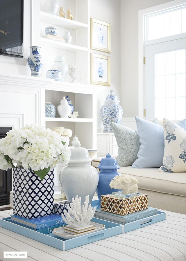 Decorate ​shelves ⁣with blue-themed⁢ books in your blue living room