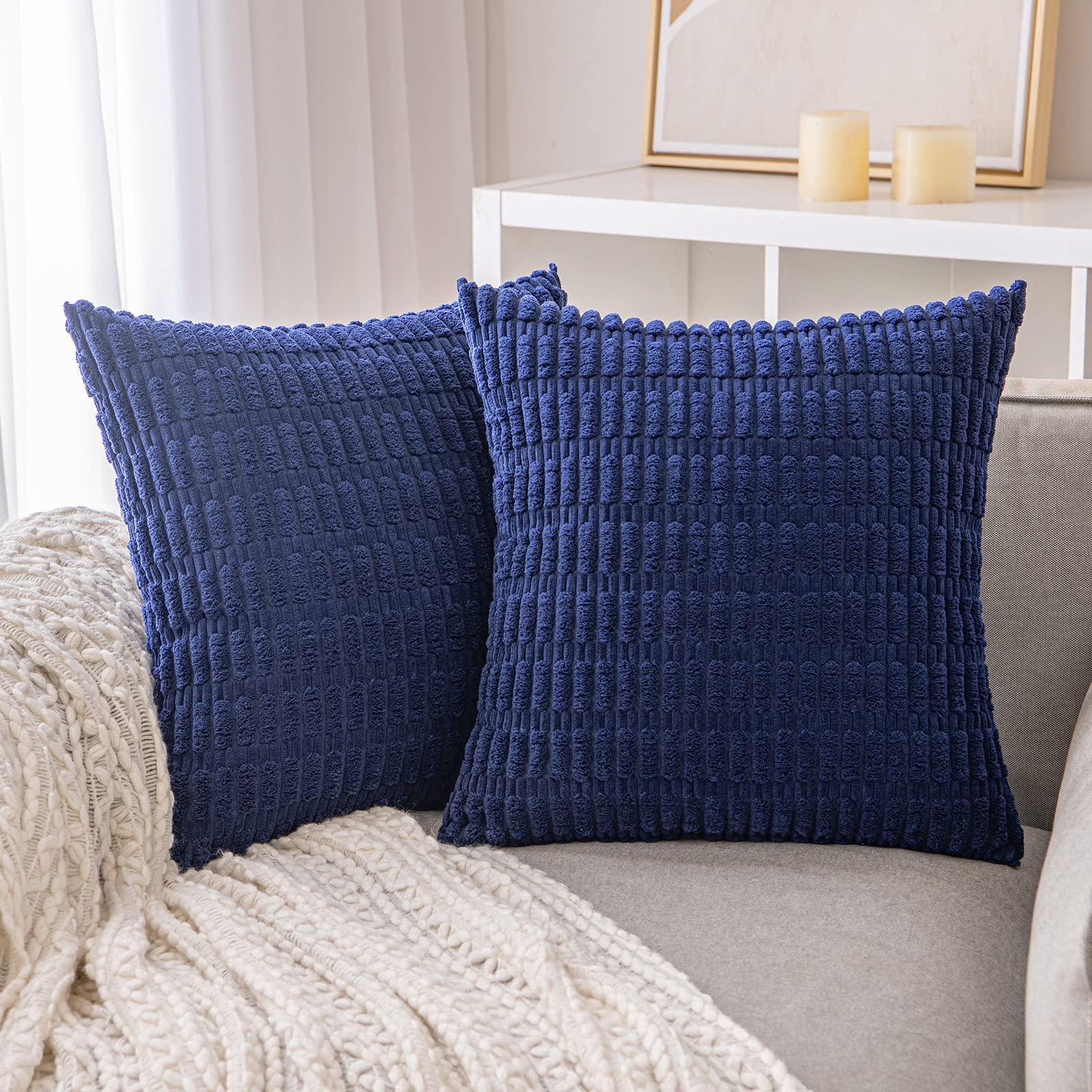 Add navy accent pillows for a pop in​ your blue living room