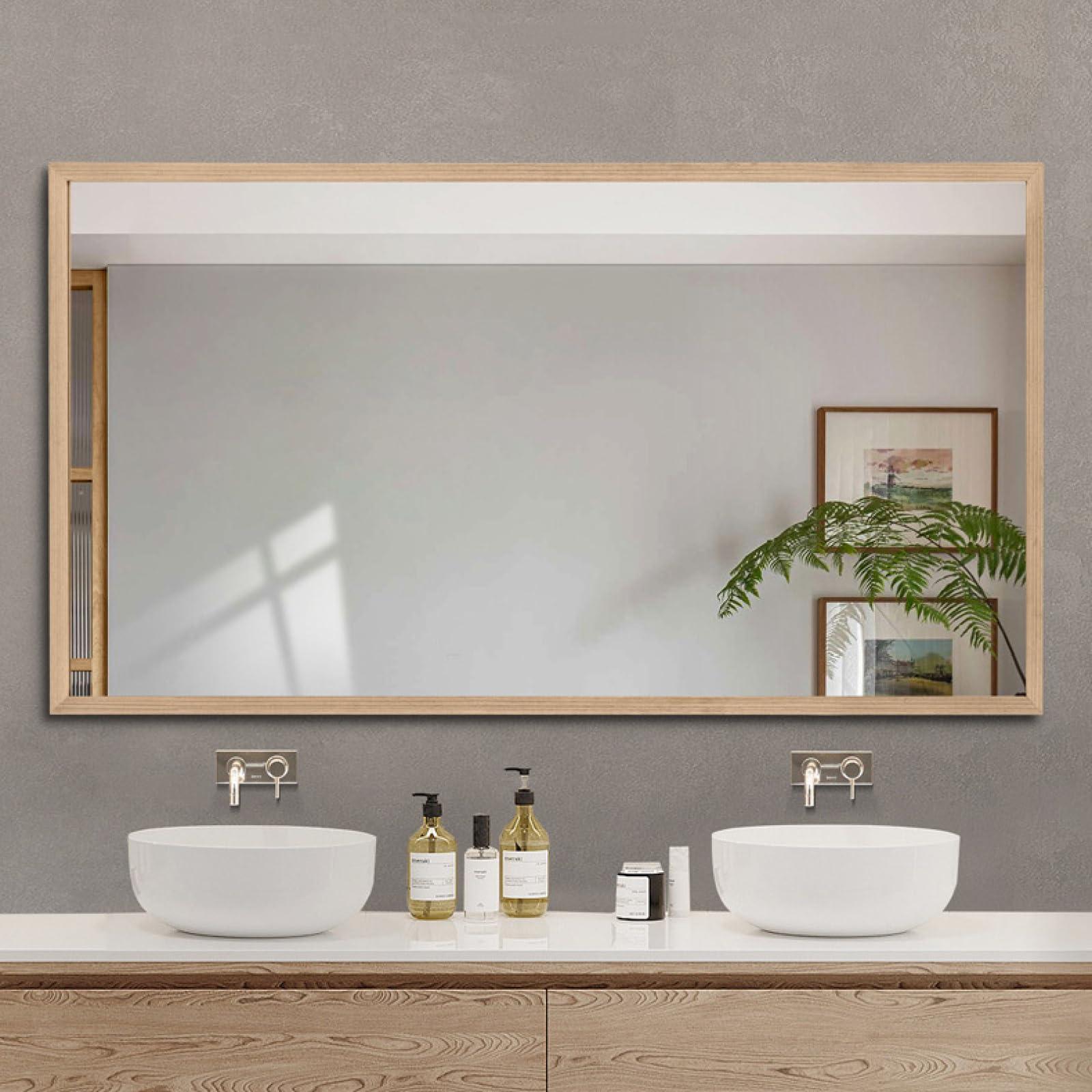 Incorporate a large mirror to reflect natural light in your farmhouse bathroom space