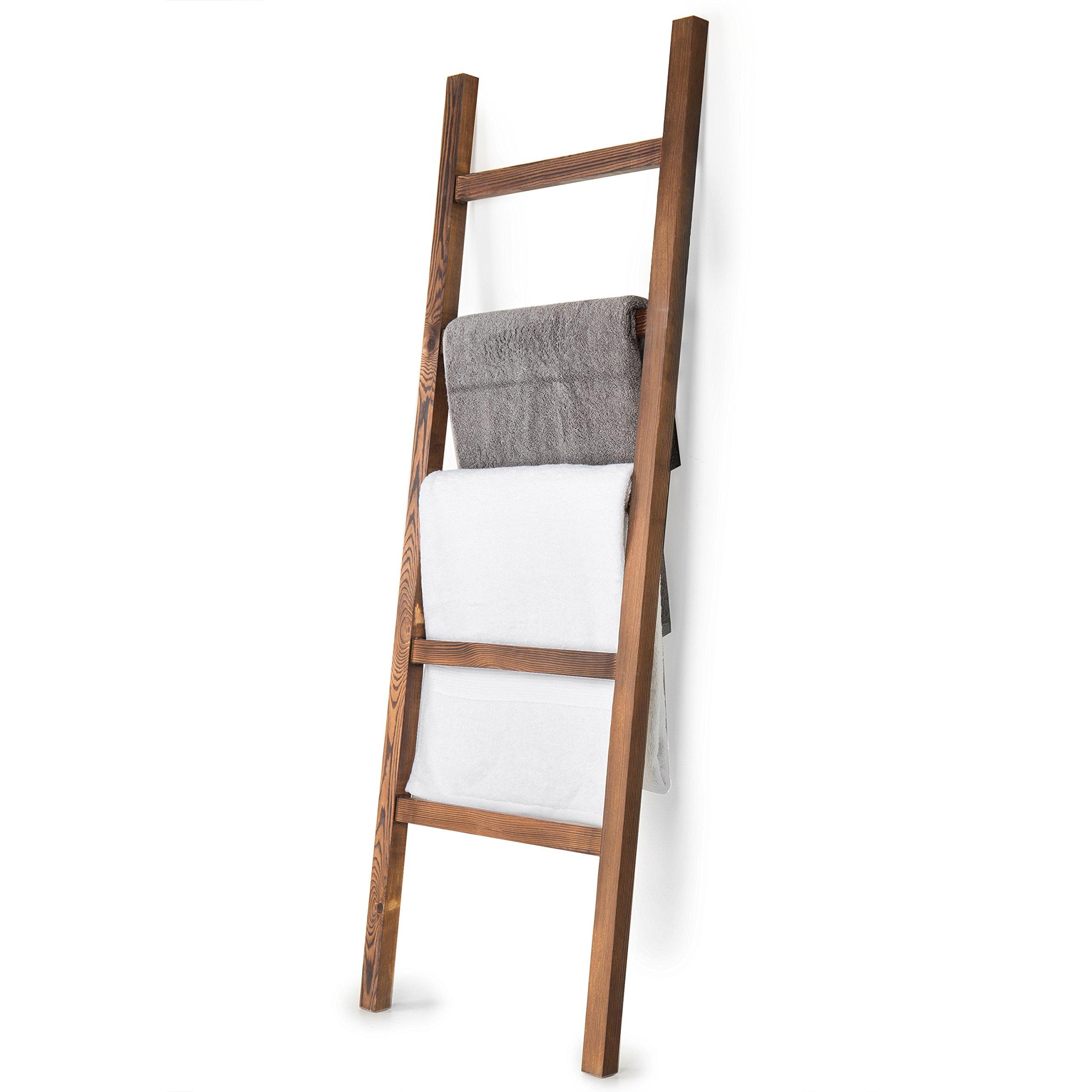 Use a wooden ladder ⁤for towel storage in your stylish wooden bathroom