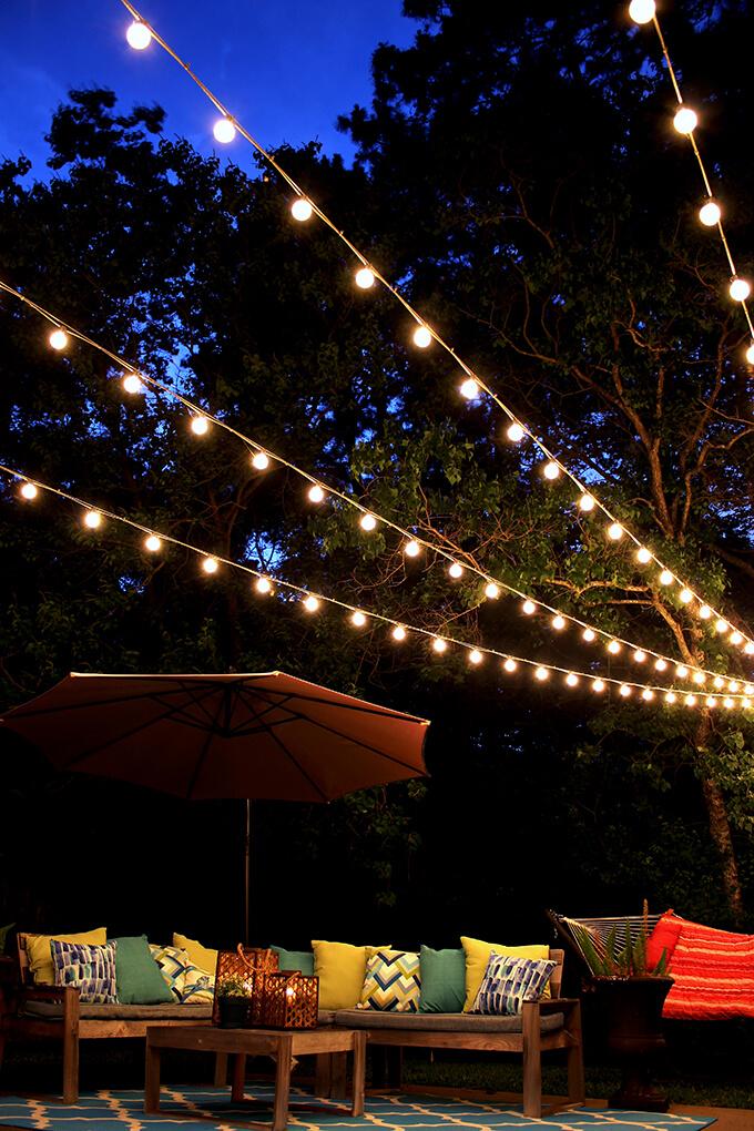 Install string lights to create ‍magical evenings in your backyard