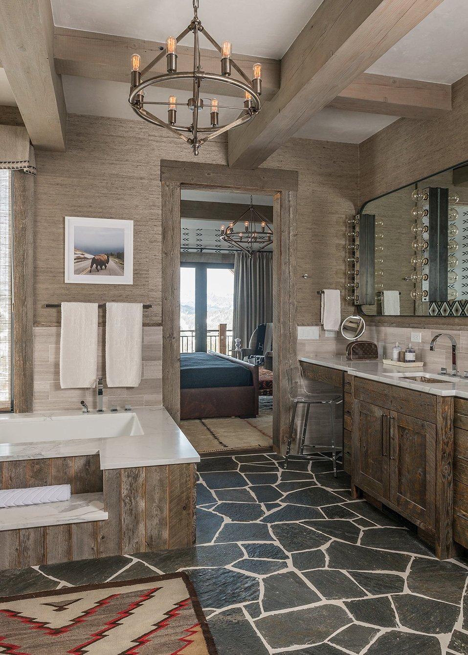 Rustic chandeliers ​illuminate your Chalet Bathroom‍ with warmth