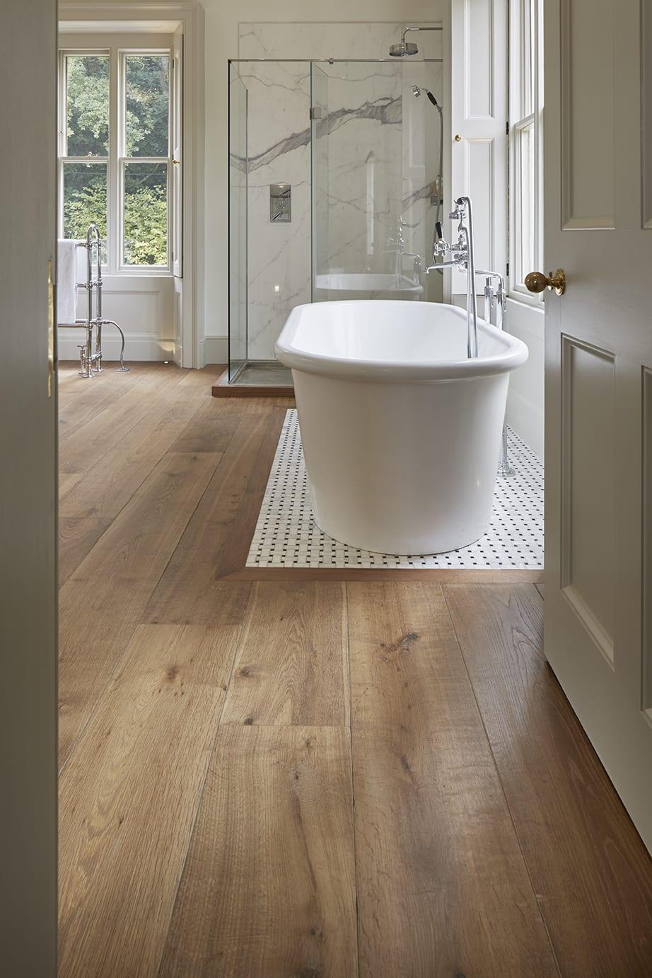 Use warm wooden bathroom​ flooring to create a welcoming​ and soothing environment