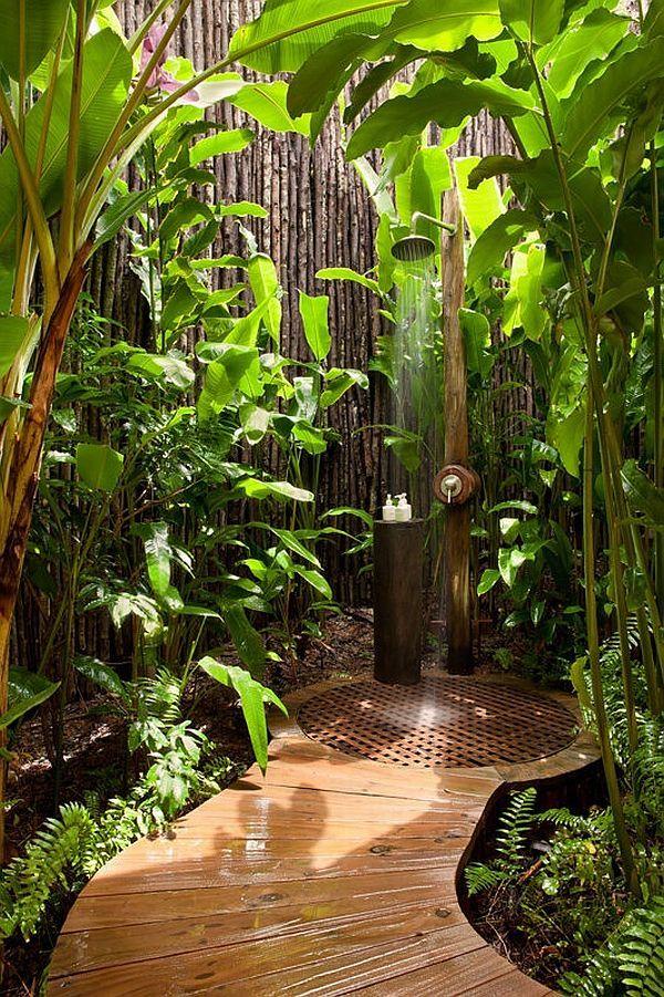 Curate an outdoor-inspired wooden bathroom with ⁤a shower that ⁤flows to ⁣nature