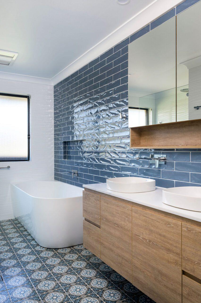 Bright, patterned tiles enhance the charm of a boho bathroom