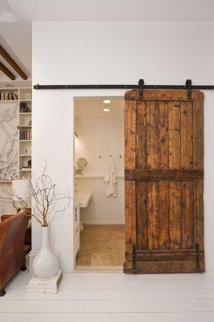 Incorporate sliding barn doors for a rustic touch in your wooden bathroom design