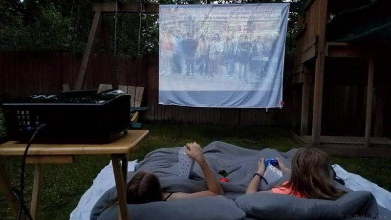 Set up‌ a backyard movie area⁤ with a projector and blankets