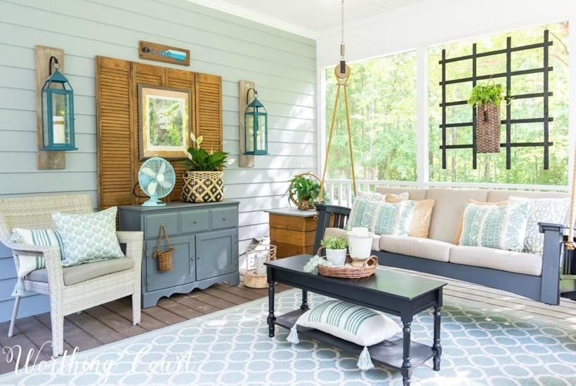 Utilize wall-mounted ​shelves for decorative items in your Screened Porch