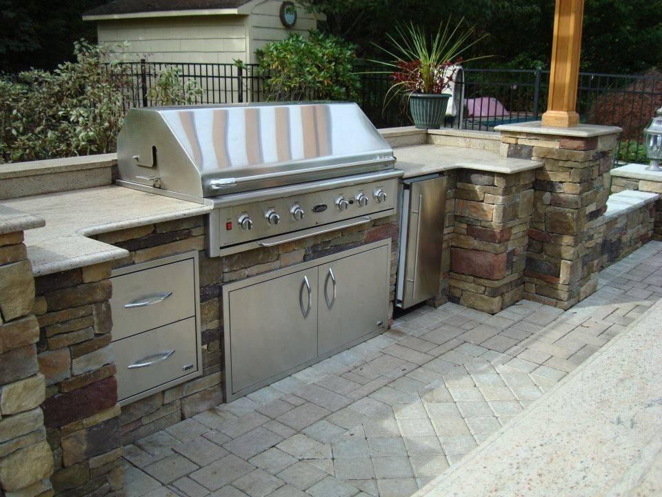 Use ‌an outdoor ⁣kitchen for ⁢gourmet meals in your backyard