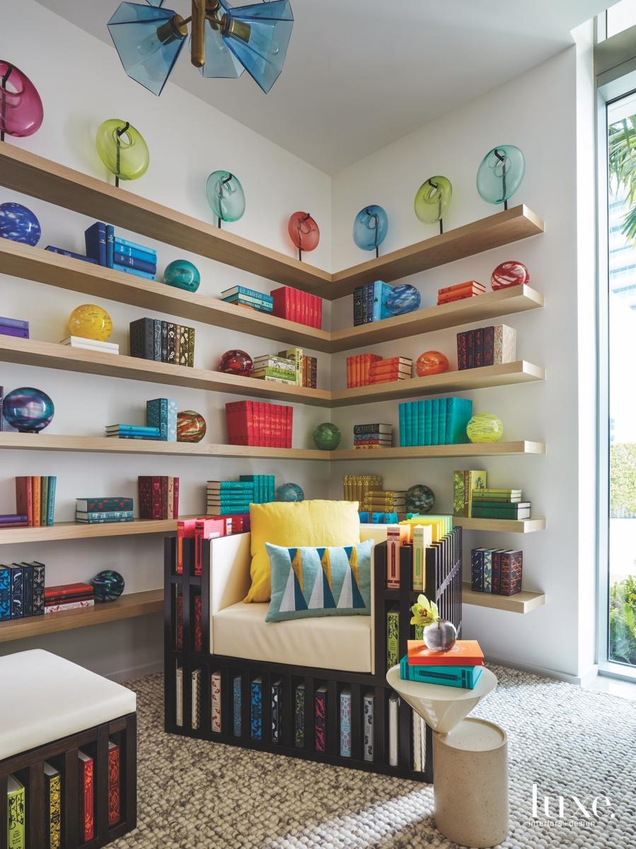 Display a collection of books on open shelves in your eclectic living​ room