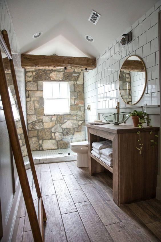 Incorporate wooden beams on the ceiling to enhance the cabin-like​ vibe of your bathroom