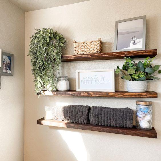 Open shelving displays neatly arranged towels and decor ⁣in your Farmhouse Bathroom