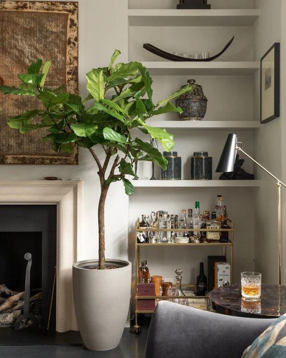 A large indoor plant,‌ like a fiddle leaf ​fig, elevates your Earthy Living​ Room