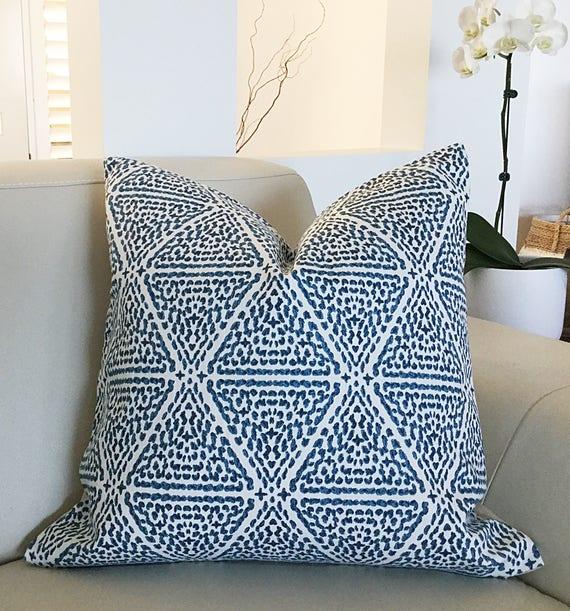 Incorporate blue patterned cushions for a playful touch