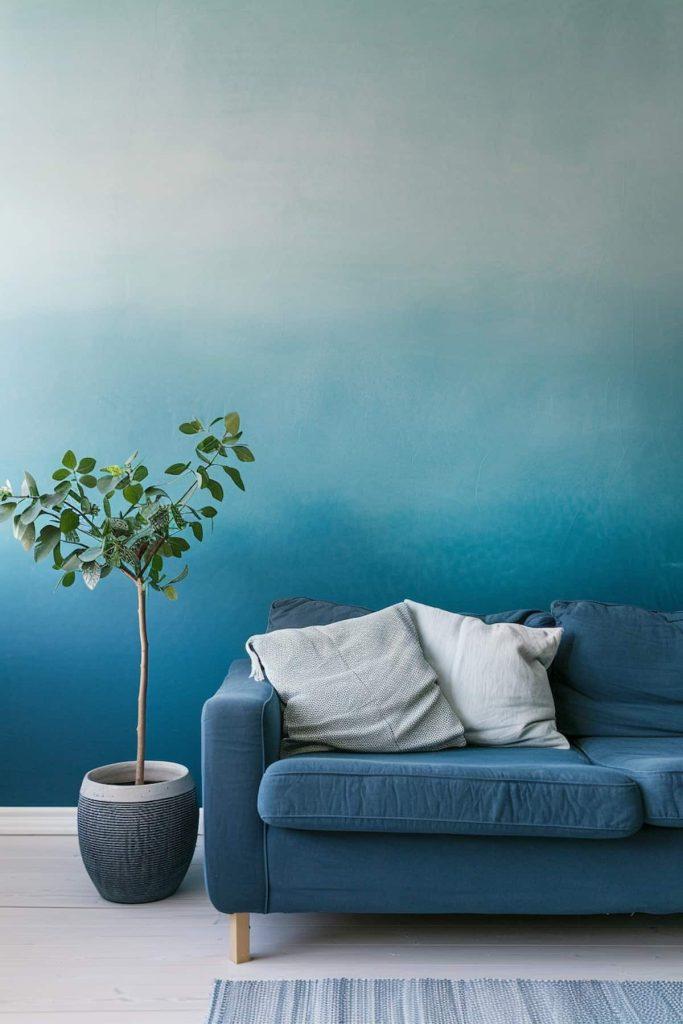 Try a ​blue ombre effect on walls for a unique living room design