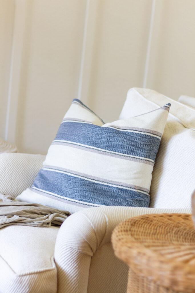 Incorporate soft sky blue pillows for a serene vibe