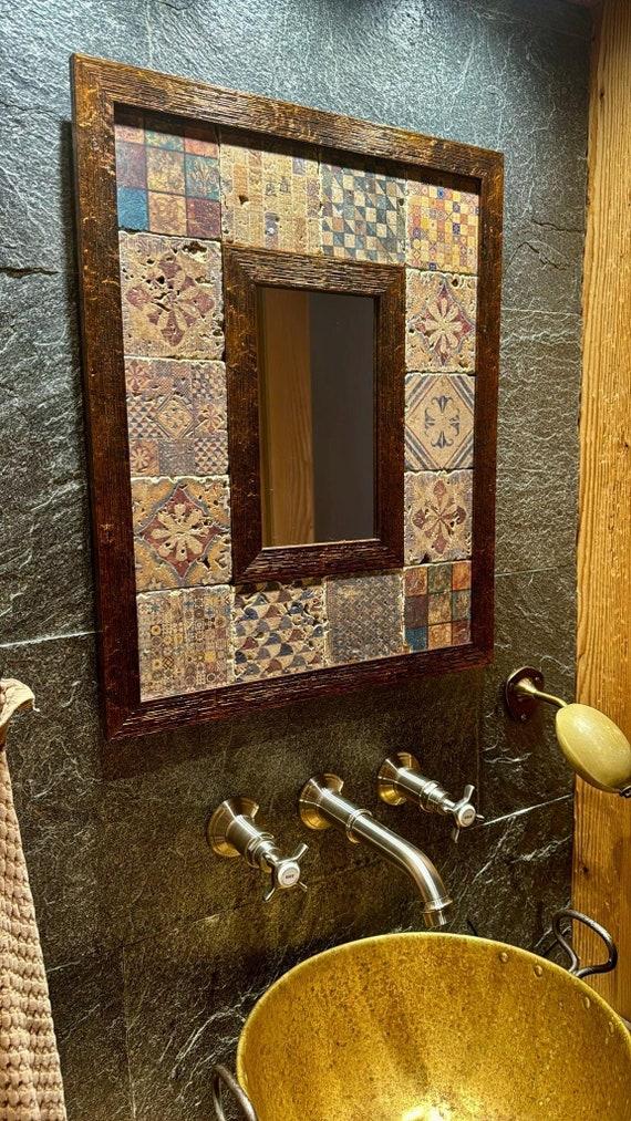 A vintage mirror reflecting boho bathroom elegance