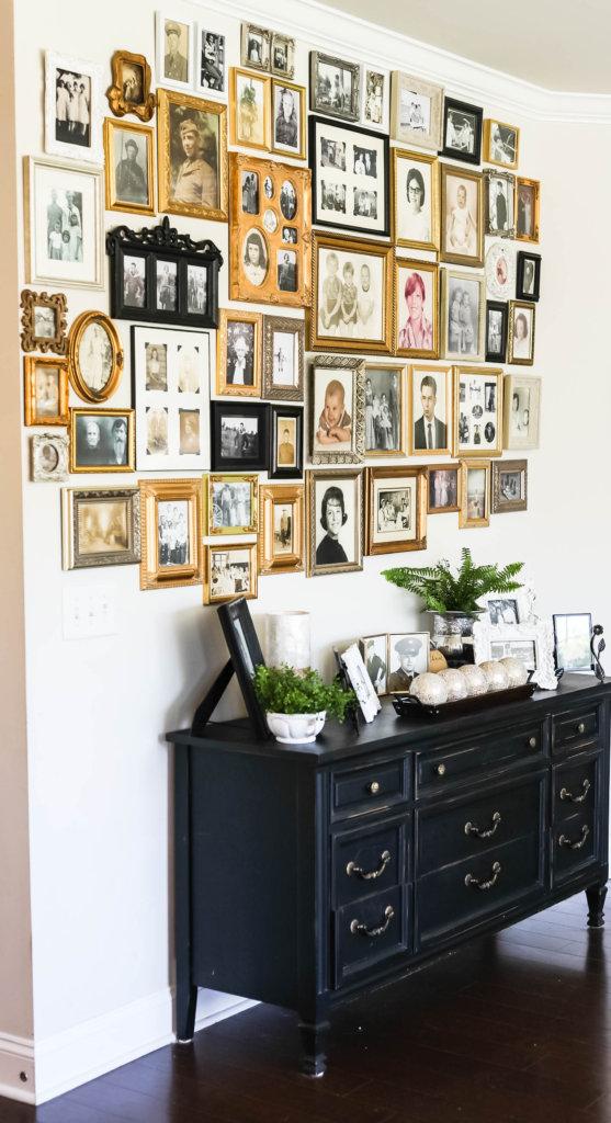 Create a gallery wall with family photos in vintage frames to personalize your space