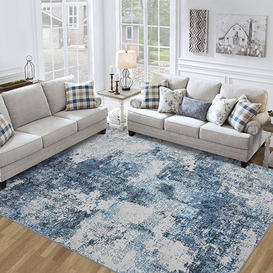 Opt⁤ for a blue‍ living​ room rug to anchor ​your decor