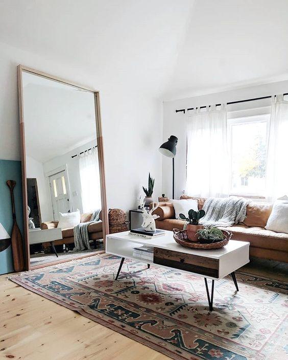 Use an‍ oversized mirror ⁣to⁢ amplify light and space in your Boho ⁤Living Room