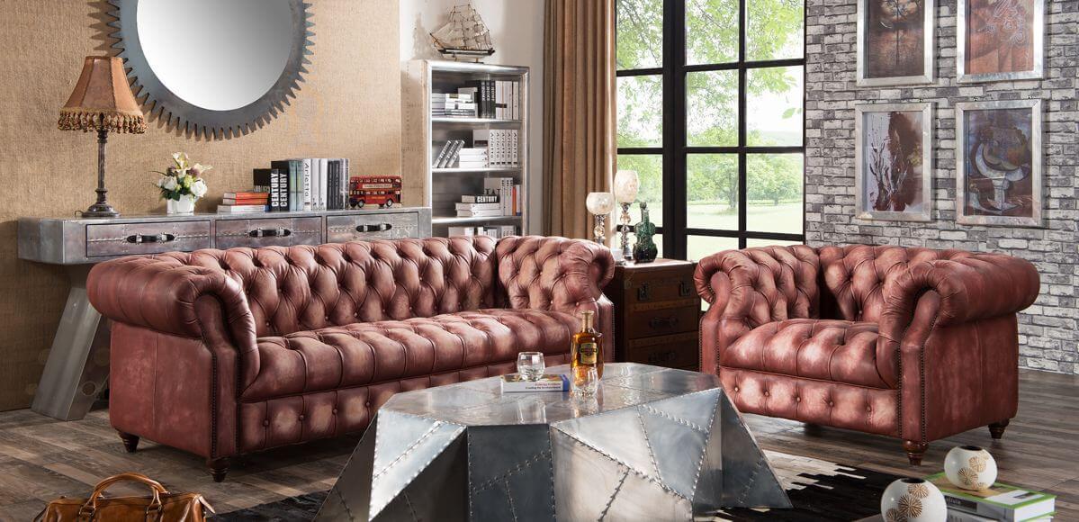 Incorporate a distressed leather sofa for a classic <a href=