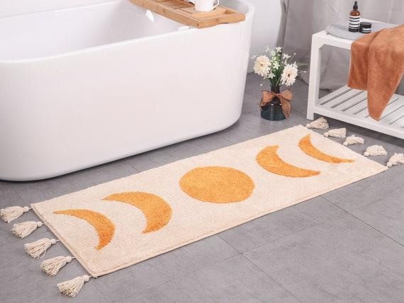 Vibrant, patterned rugs to warm up your boho bathroom floor