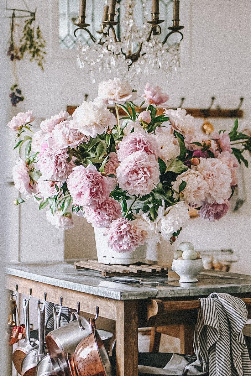 Curate a selection of vintage vases filled with seasonal blooms to decorate your Vintage Living Room