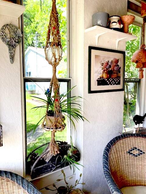 Hang macramé plant hangers to add vertical interest to your Earthy Living Room