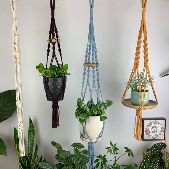 Macramé plant hangers for a boho bathroom vibe