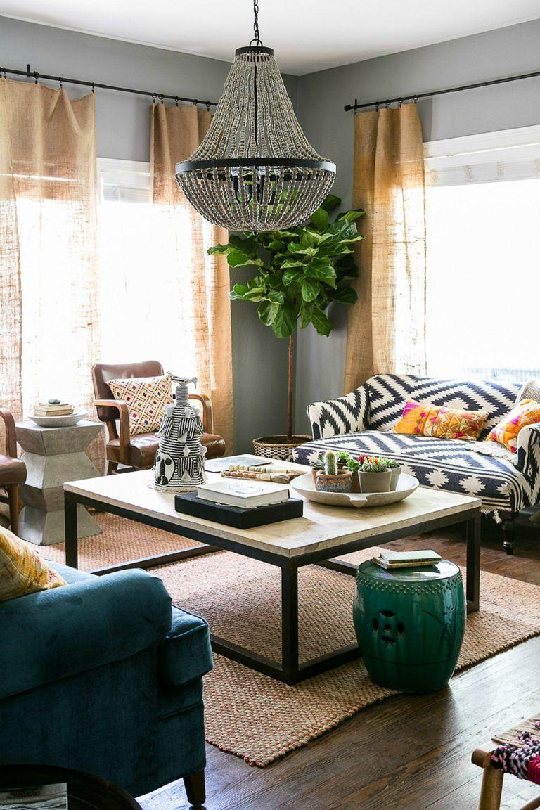 Layer lighting with lamps and candles ​to enhance​ ambiance in your Boho Living Room