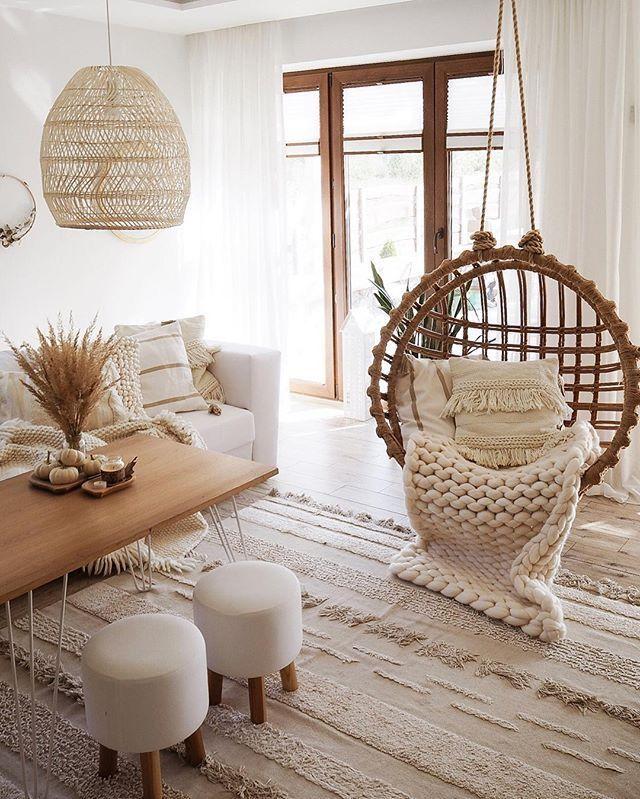 A ‌hanging⁣ chair creates an inviting nook in your Boho Living Room