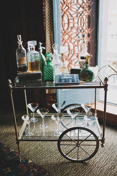 Use a vintage bar ‌cart to serve drinks and showcase glassware in your vintage living room