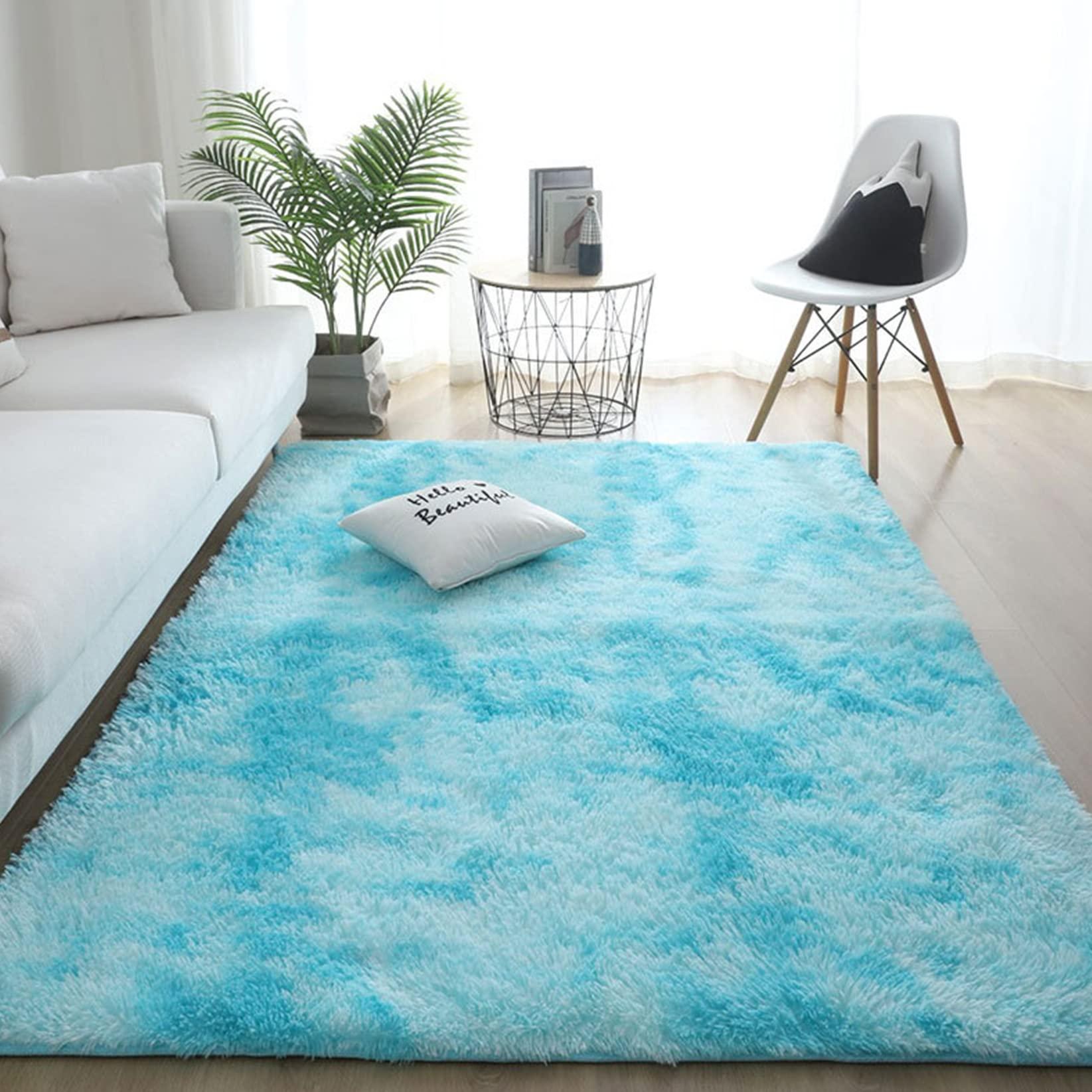 Use​ soft fabrics​ for cushions and ‍rugs ​in your blue living room