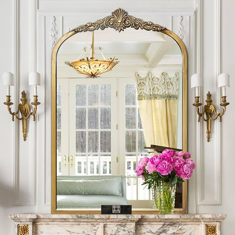 Use old-fashioned mirrors to create depth and ​reflect your vintage living rooms charm