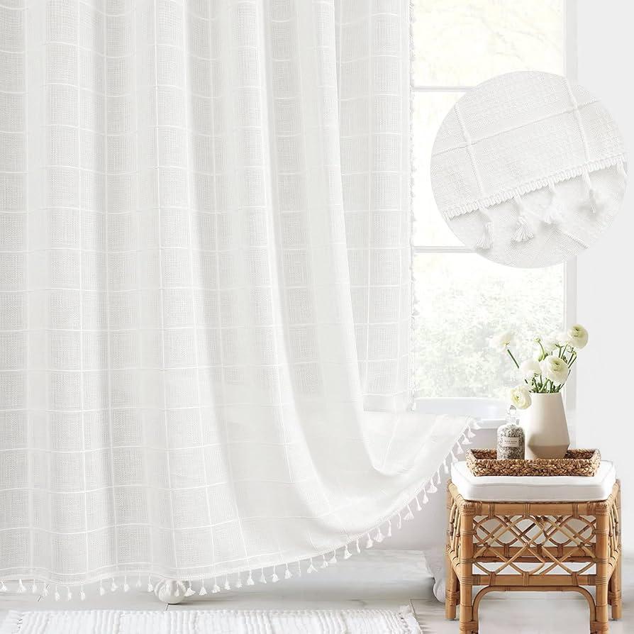 Enhance airiness with sheer curtains in your boho​ bathroom