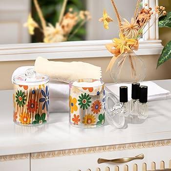 Colorful glass jars for organized beauty items in your​ boho bathroom