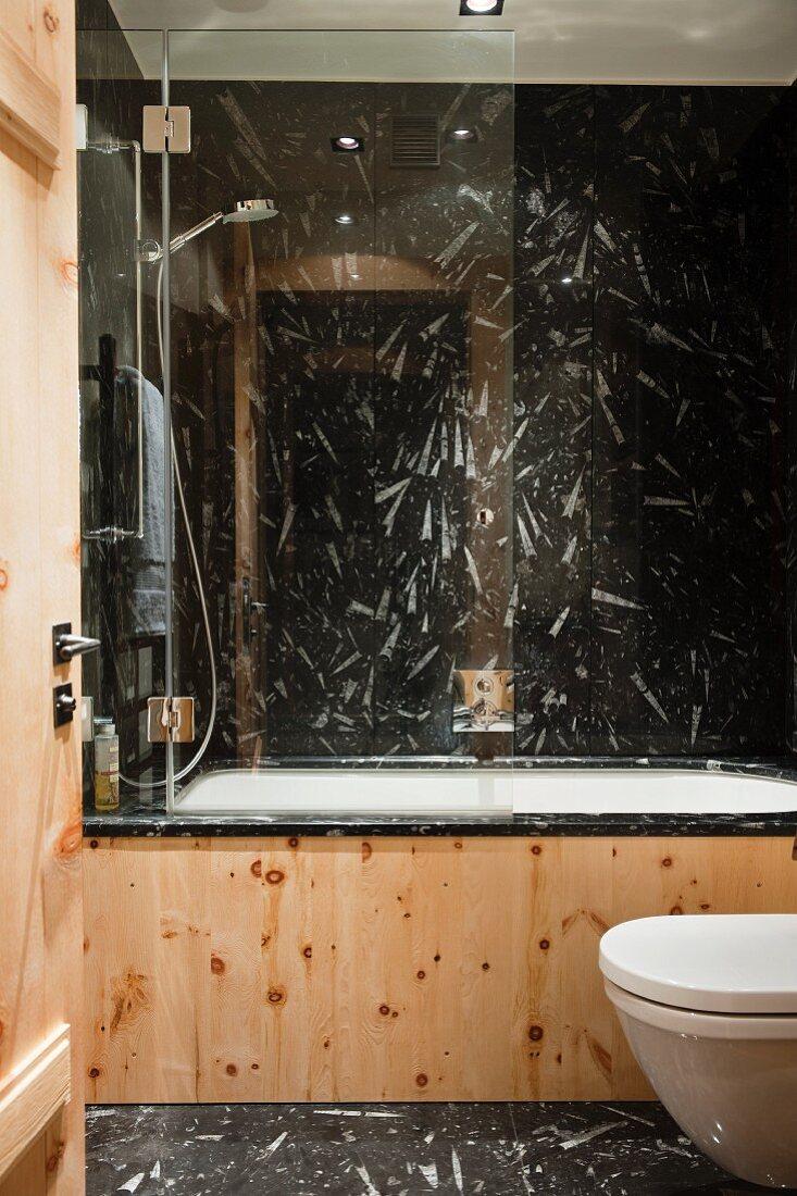 Stone ​tiles: Earthy textures bring warmth to your Chalet Bathroom decor