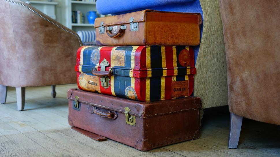 Incorporate vintage suitcases stacked in a corner for both storage and stylish decor