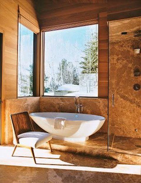 Embrace natural light with large windows in your Chalet Bathroom