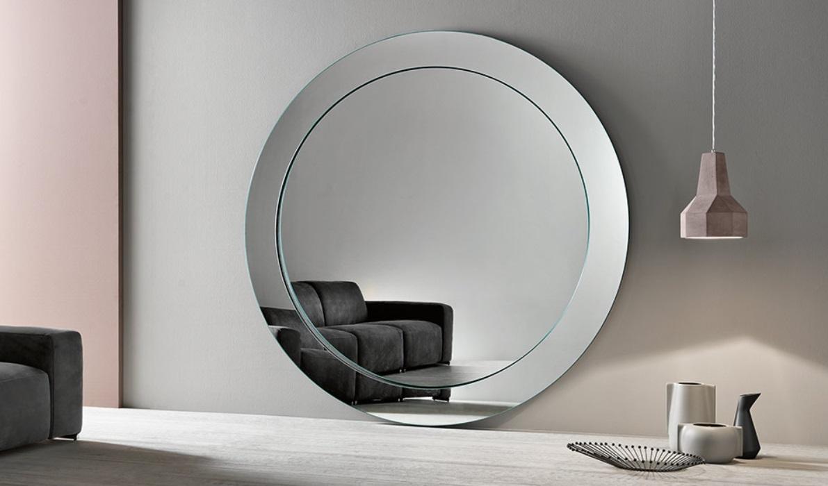 Use mirrors strategically to reflect light and ​create depth in your contemporary living room