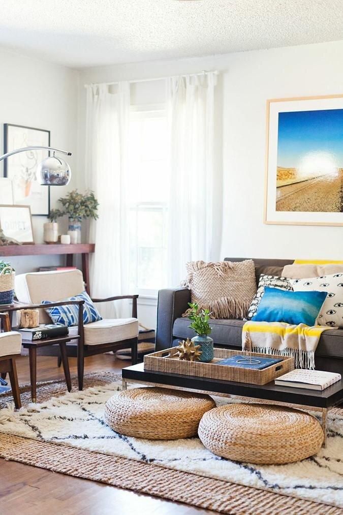 Create zones with area rugs to define spaces in a spacious contemporary living room