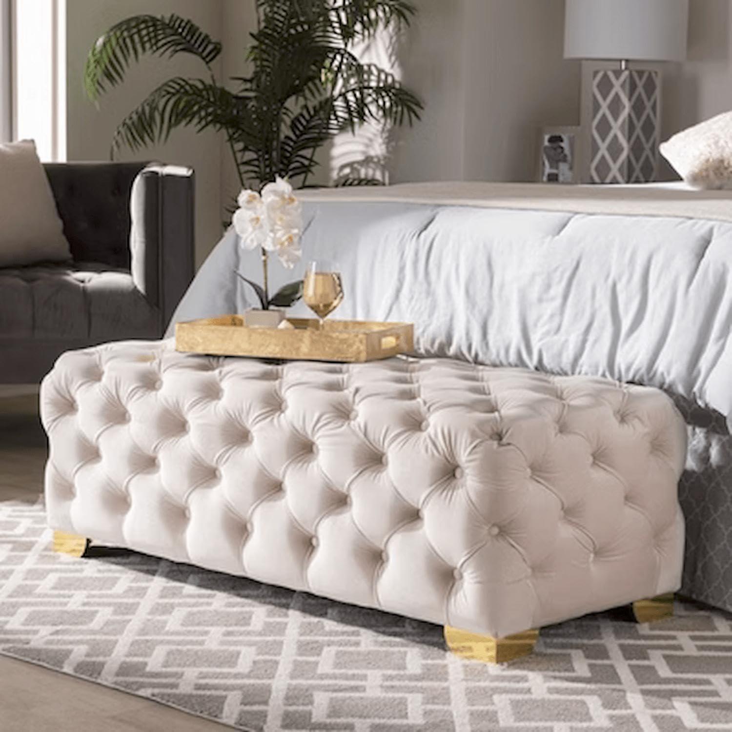 Add a tufted ottoman for functionality‍ and style in the vintage living room